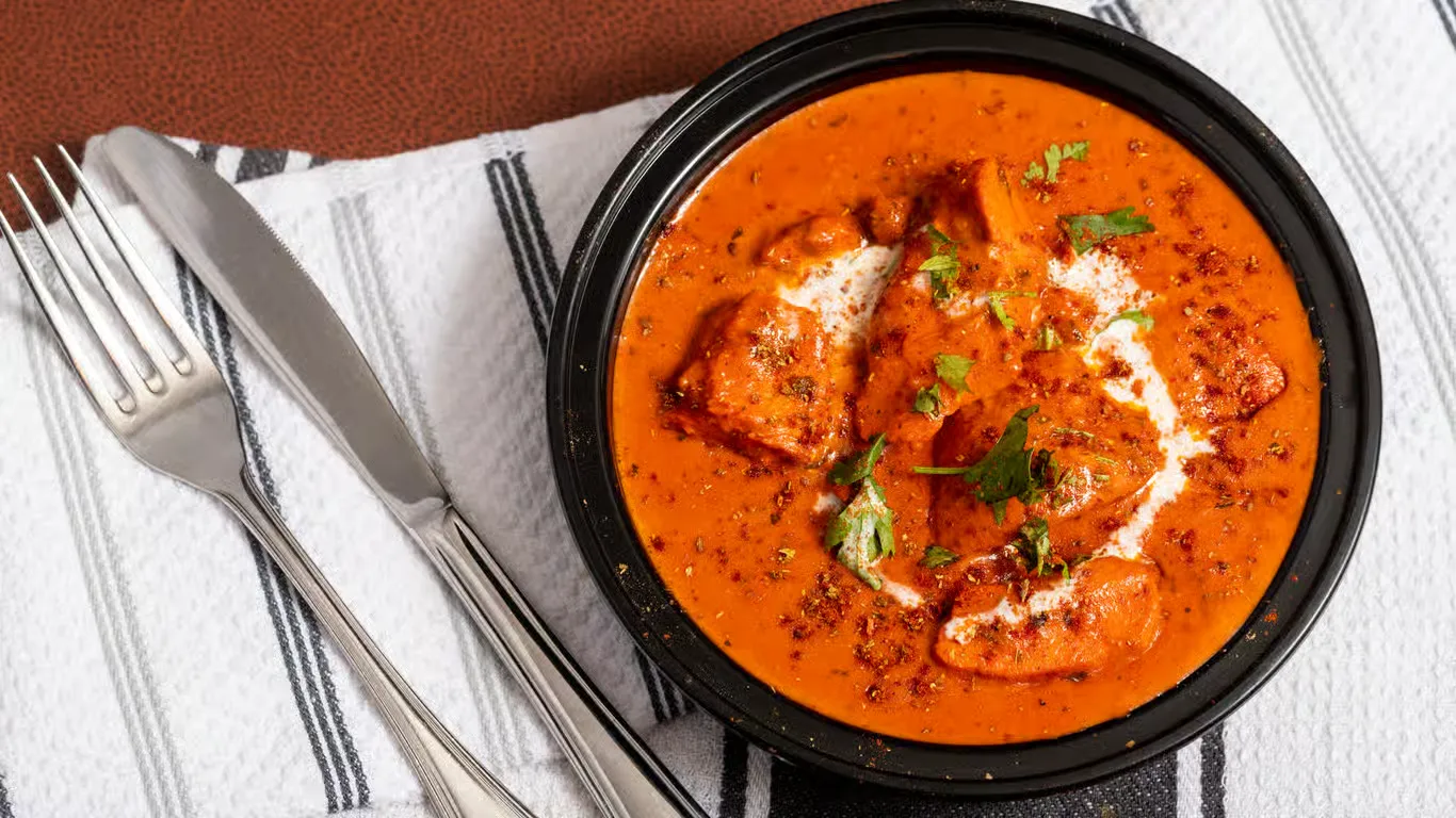 Butter Chicken at Ivory Restaurant Winnipeg - most beloved dish, rich creamy tomato sauce